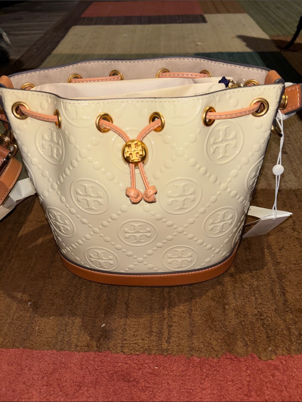 Tory Burch Cream Embossed Leather Bucket Bag with Tan Trim and Peach Drawstring